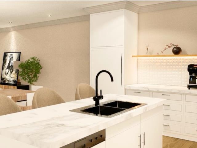 kitchen featuring light stone counters, crown molding, a sink, light wood-style flooring, and white cabinets