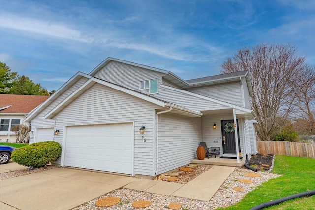 25 Cherbourg Ct, Madison, WI 53711 - view of front of house with fence, an attached garage, and driveway