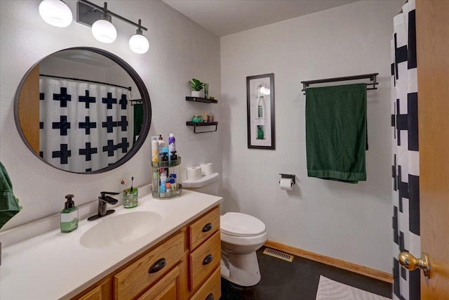 25 Cherbourg Ct, Madison, WI 53711 - bathroom featuring toilet, vanity, curtained shower, and baseboards