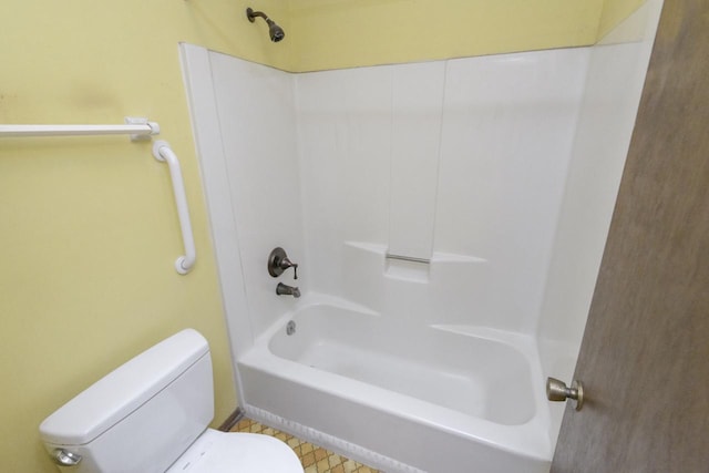 bathroom with toilet, tile patterned flooring, and shower / bath combination