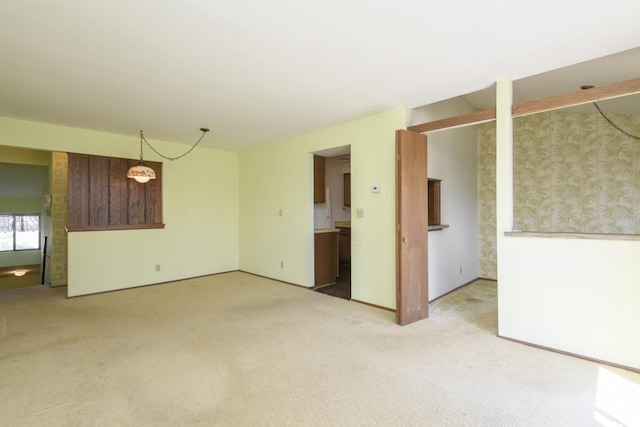 empty room featuring light carpet