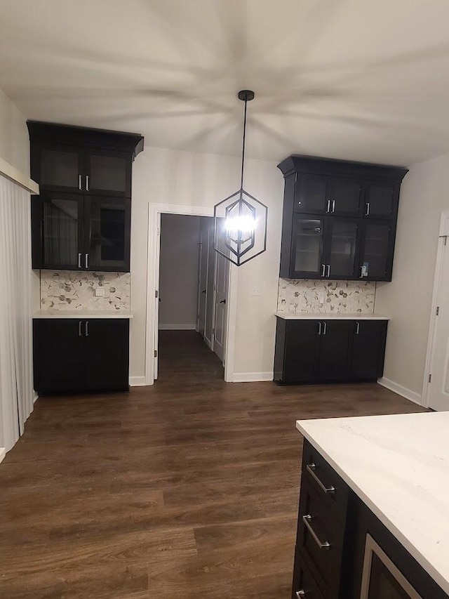 2034 N 13th St, Milwaukee, WI 53205 - kitchen featuring dark cabinets, decorative backsplash, and light countertops