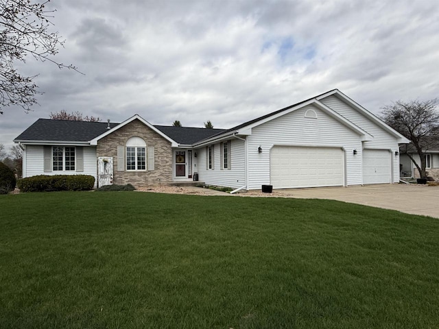 ranch-style home featuring concrete driveway, an attached garage, and a front yard
