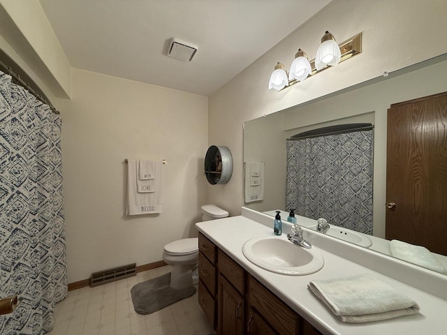 bathroom featuring visible vents, tile patterned floors, toilet, and vanity