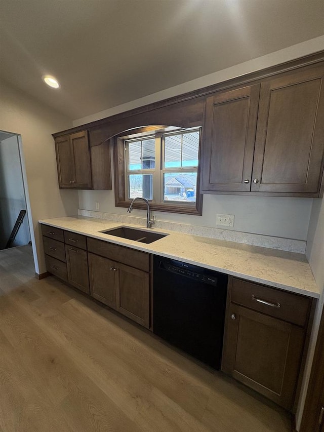 1354 Shelby Ln, De Pere, WI 54115 - kitchen with a sink, dark brown cabinetry, light wood-style floors, black dishwasher, and light countertops