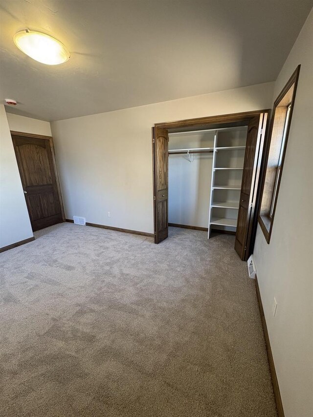 1354 Shelby Ln, De Pere, WI 54115 - unfurnished bedroom featuring visible vents, baseboards, and carpet flooring