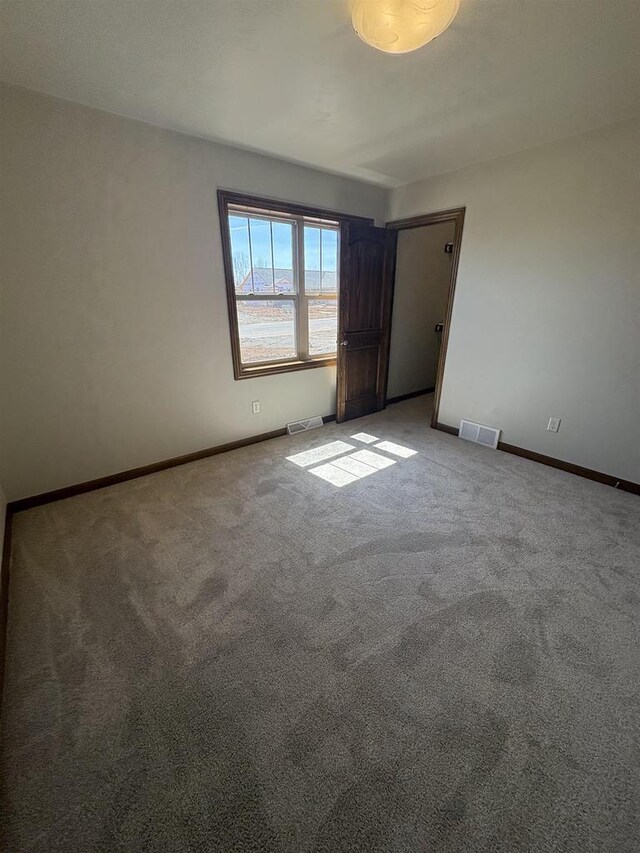 1354 Shelby Ln, De Pere, WI 54115 - unfurnished bedroom with light carpet, visible vents, and baseboards