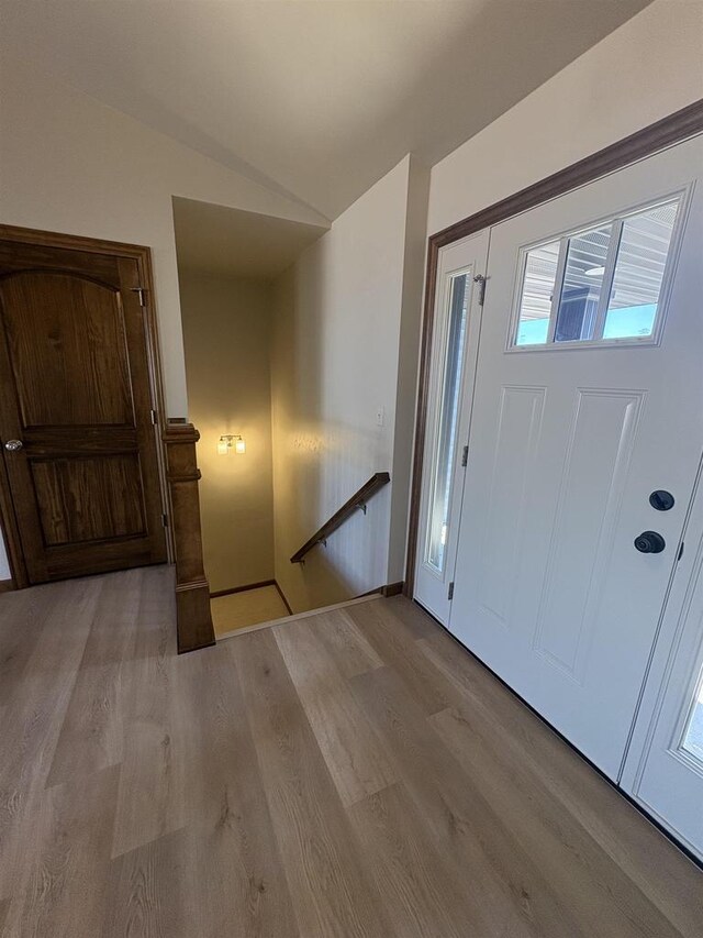 1354 Shelby Ln, De Pere, WI 54115 - entrance foyer with baseboards, vaulted ceiling, and wood finished floors
