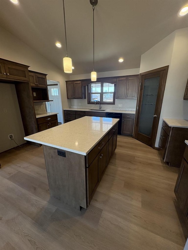 1354 Shelby Ln, De Pere, WI 54115 - kitchen with dark brown cabinets, a sink, light wood-type flooring, black dishwasher, and a kitchen island