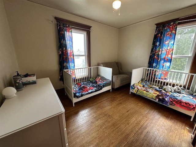 bedroom with hardwood / wood-style flooring