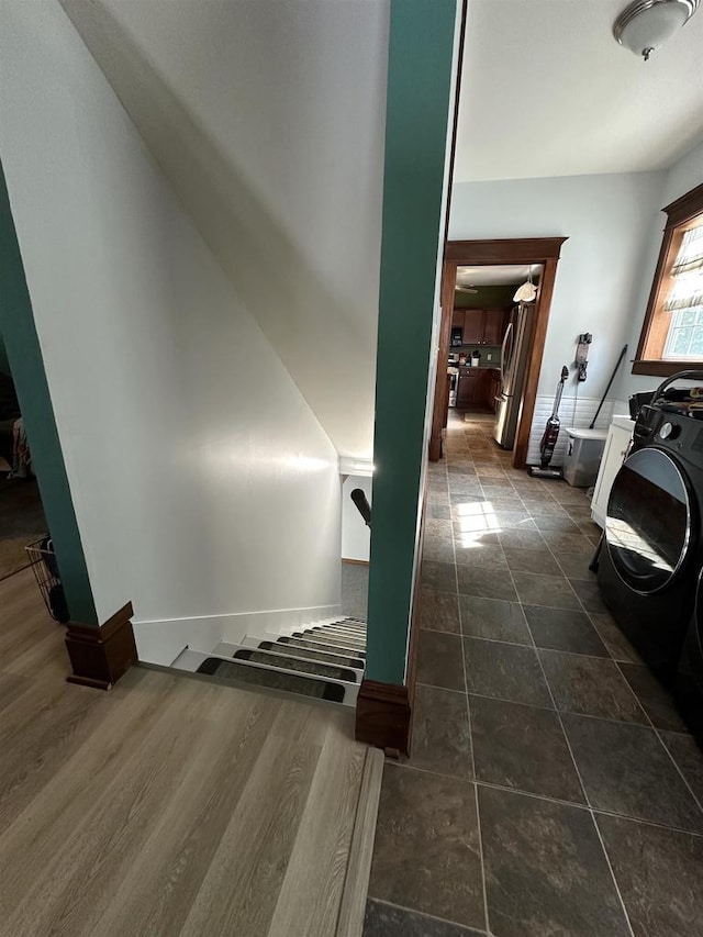 staircase featuring baseboards