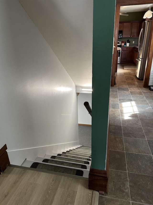 stairs featuring baseboards
