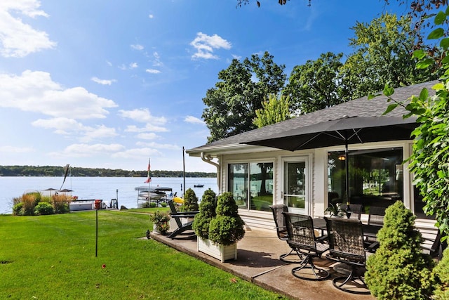 exterior space with a water view