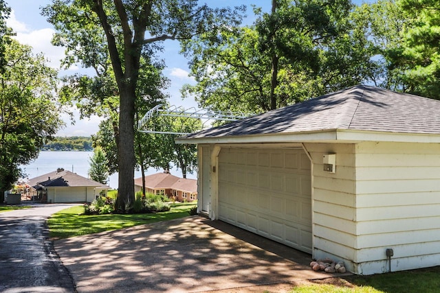 detached garage with a water view