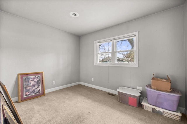 interior space with baseboards and visible vents