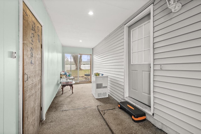 interior space with carpet floors, heating unit, and recessed lighting