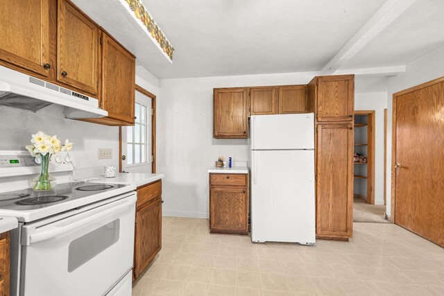kitchen with brown cabinetry, white appliances, beamed ceiling, light countertops, and under cabinet range hood