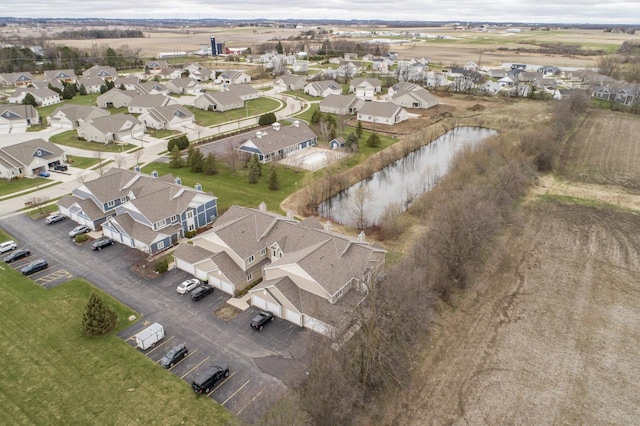aerial view featuring a water view and a residential view