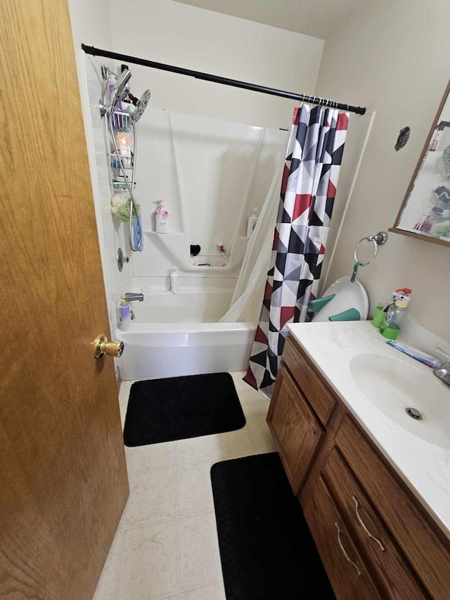 bathroom with shower / bath combo, vanity, and tile patterned flooring
