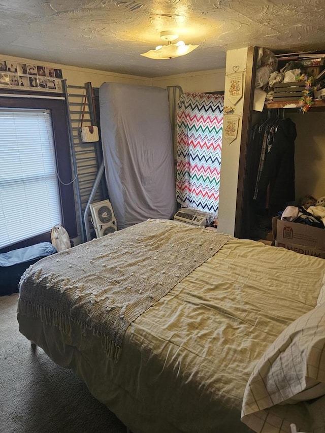 carpeted bedroom with a closet