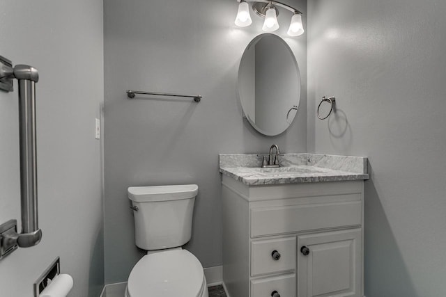 bathroom with toilet and vanity