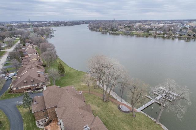 birds eye view of property featuring a water view and a residential view