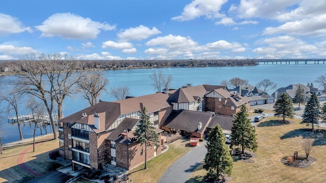 bird's eye view with a water view and a residential view