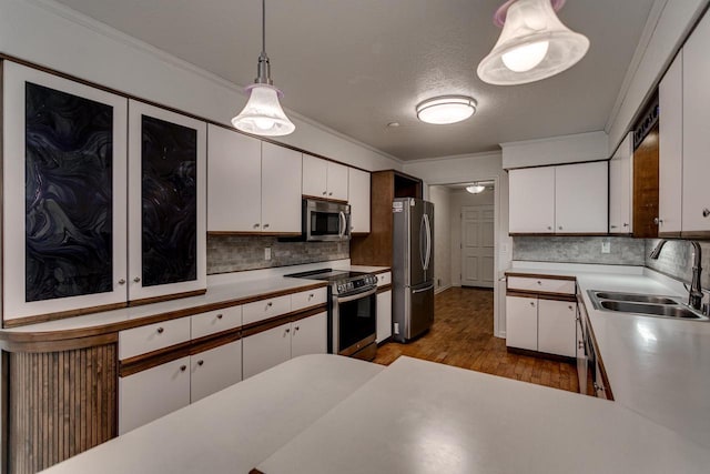 kitchen with white cabinets, a sink, and appliances with stainless steel finishes