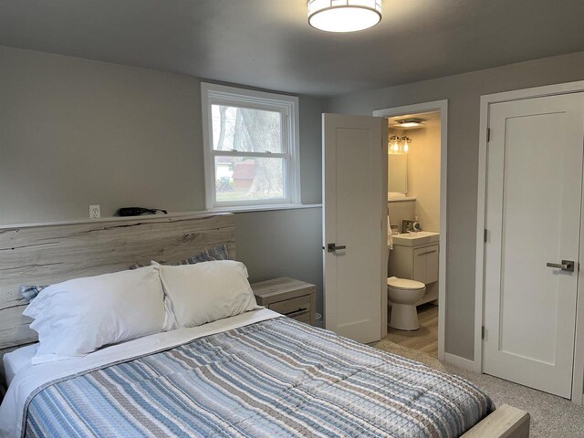1610 S Oneida St, Green Bay, WI 54304 - bedroom with light carpet and ensuite bathroom