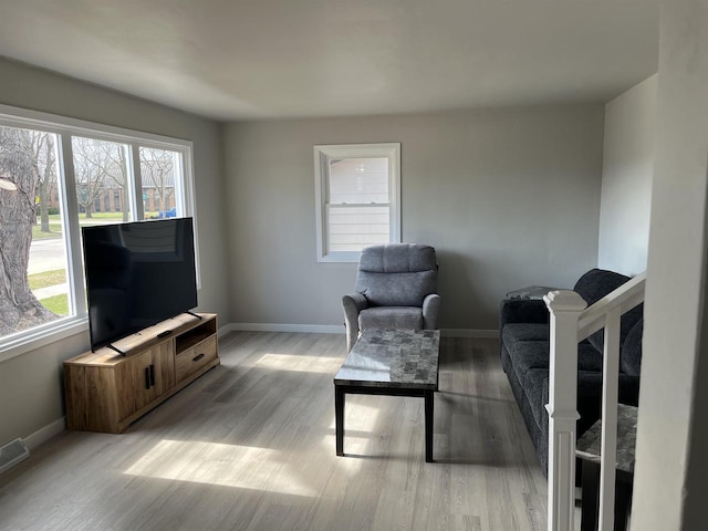 1610 S Oneida St, Green Bay, WI 54304 - living area featuring light wood-style flooring and baseboards