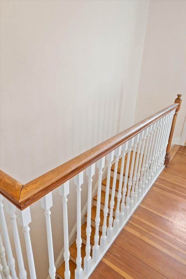 staircase with wood finished floors