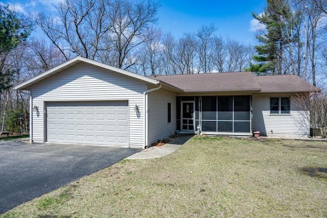 W3760 W Lemonweir Ct, Mauston, WI 53948 - ranch-style house with a front lawn, driveway, a garage, a shingled roof, and a sunroom