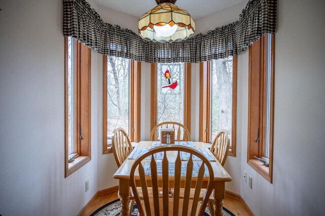 W3760 W Lemonweir Ct, Mauston, WI 53948 - dining area featuring light wood finished floors and baseboards