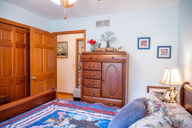 W3760 W Lemonweir Ct, Mauston, WI 53948 - bedroom featuring a closet, wood finished floors, visible vents, and ceiling fan