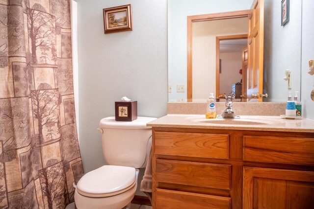 W3760 W Lemonweir Ct, Mauston, WI 53948 - full bathroom featuring toilet, a shower with curtain, and vanity