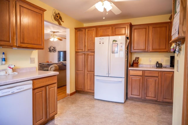 W3760 W Lemonweir Ct, Mauston, WI 53948 - kitchen featuring brown cabinetry, a ceiling fan, white appliances, and light countertops