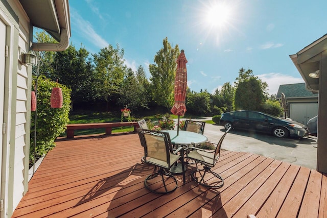 wooden deck featuring outdoor dining space