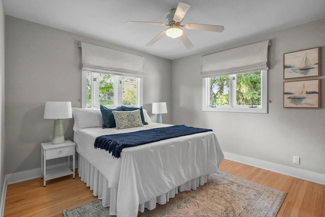 5308 Mckenna Rd, Monona, WI 53716 - bedroom with multiple windows, baseboards, and wood finished floors