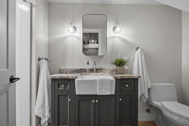 5308 Mckenna Rd, Monona, WI 53716 - half bathroom featuring vanity, toilet, and baseboards