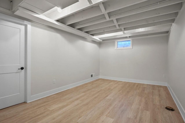 5308 Mckenna Rd, Monona, WI 53716 - below grade area with light wood-style floors and baseboards