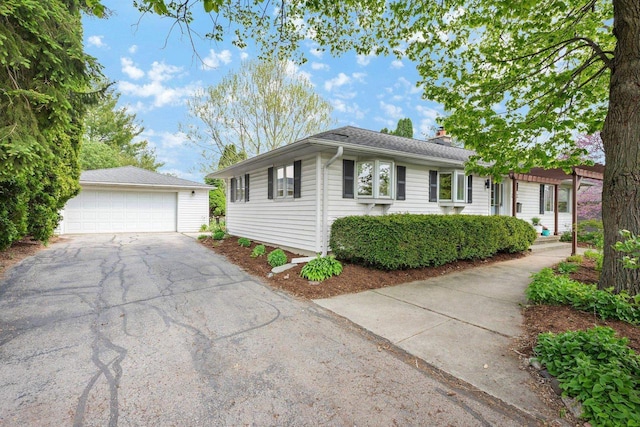 5308 Mckenna Rd, Monona, WI 53716 - view of front of property featuring a garage, a chimney, and an outbuilding