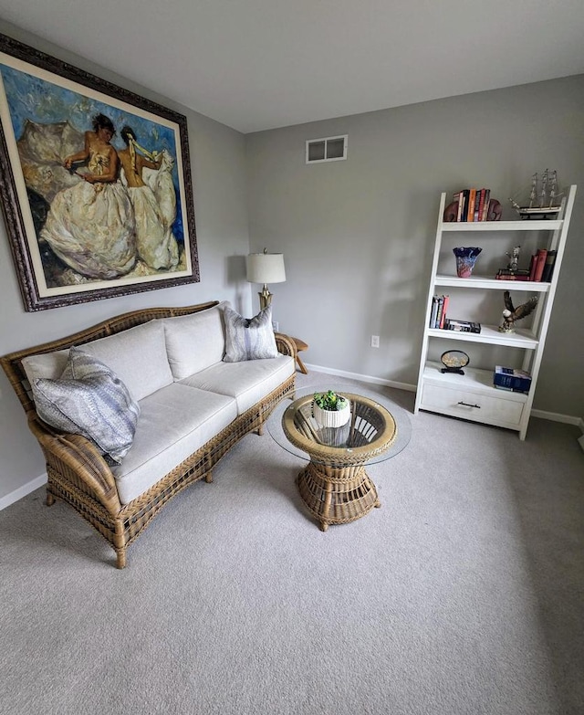 sitting room with baseboards, carpet floors, and visible vents