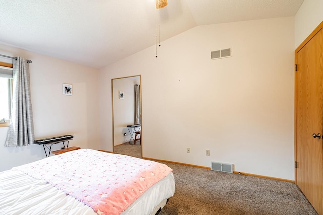 bedroom featuring visible vents, baseboards, lofted ceiling, and carpet floors