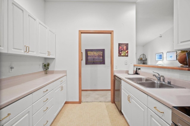 kitchen with stainless steel dishwasher, a sink, baseboards, white cabinetry, and light countertops