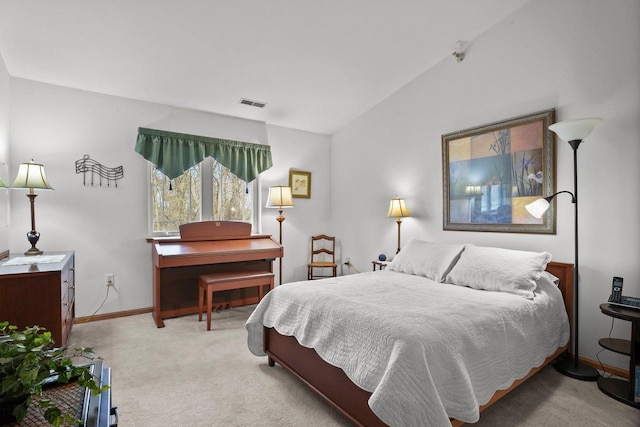 carpeted bedroom featuring visible vents, vaulted ceiling, and baseboards