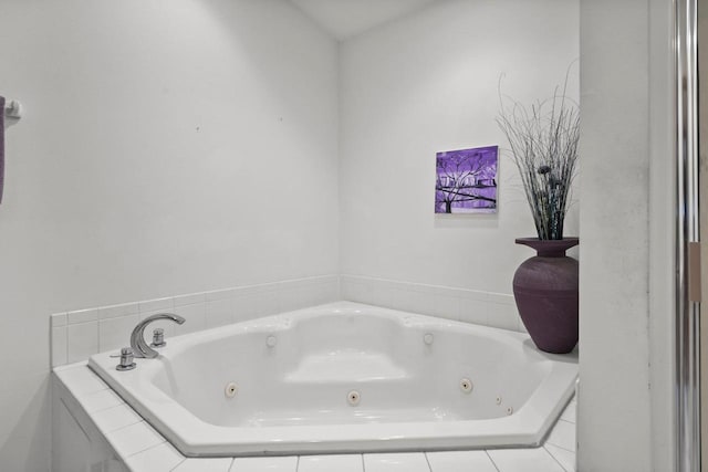 full bath with a whirlpool tub