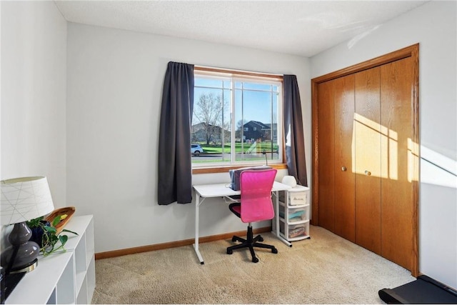 home office featuring carpet floors and baseboards