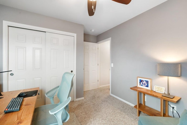 office area featuring a ceiling fan, baseboards, and carpet floors