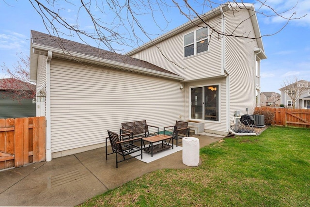 rear view of property featuring a lawn, fence private yard, central AC unit, and a patio