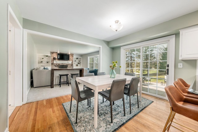 dining area with light wood finished floors